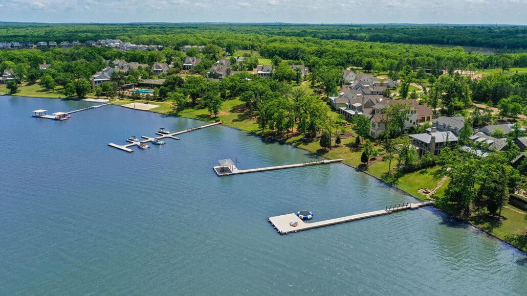 Arial view of shoreline homes and docks around Long Cove at Cedar Creek Lake