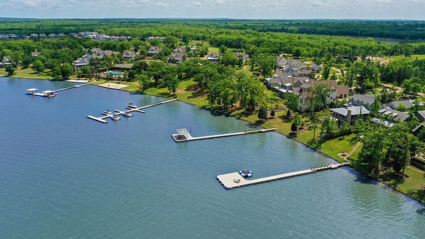 Arial view of shoreline homes and docks around Long Cove at Cedar Creek Lake