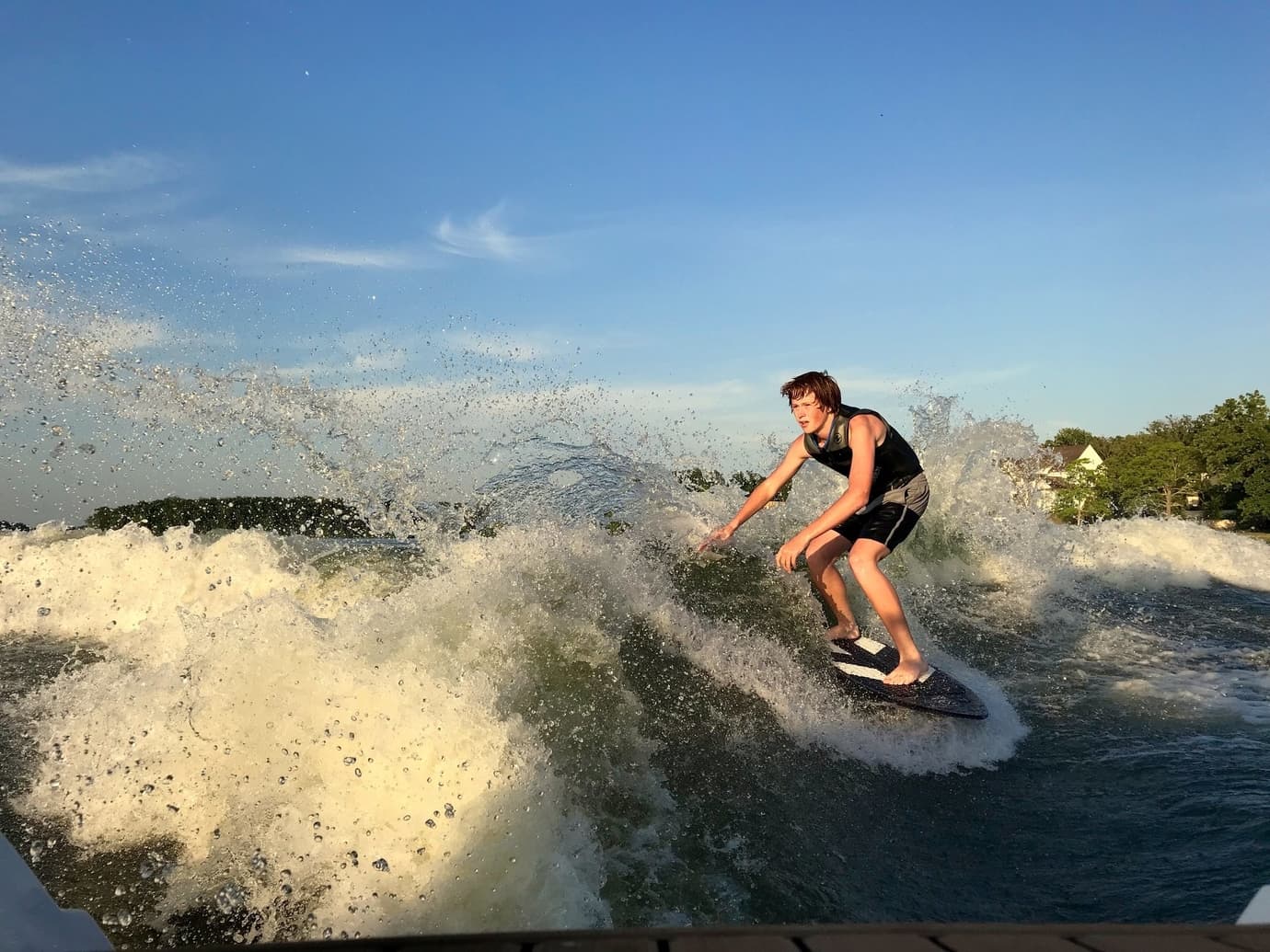 So many ways to play at Long Cove like this kid wakeboarding on the lake