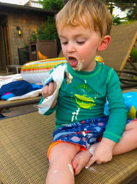 Little boy enjoying some ice cream from the grill at long cove