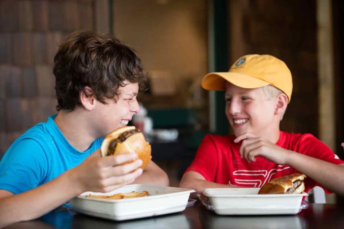 2 buddies enjoying good food and good company at Long Cove