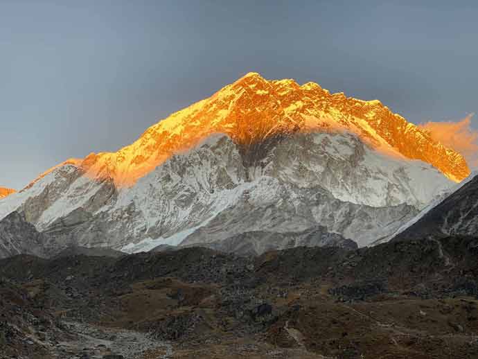 Sun shining on the top portion of a mountain for Hiking for a Higher Purpose