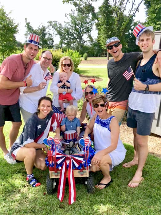 A couple of families dressed in American attire celebrating the fourth of july