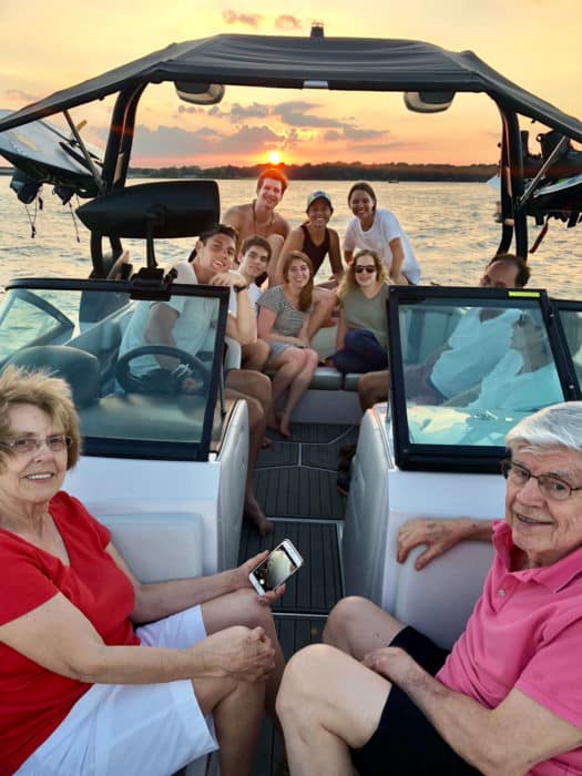 A large family enjoying the day on a boat at the long cove community at Cedar Creek Lake