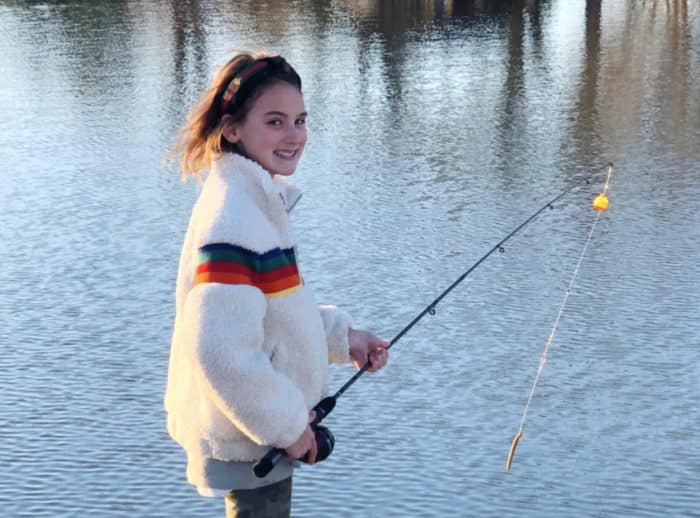 Young girl fishing in Cedar Creek Lake at Long Cove