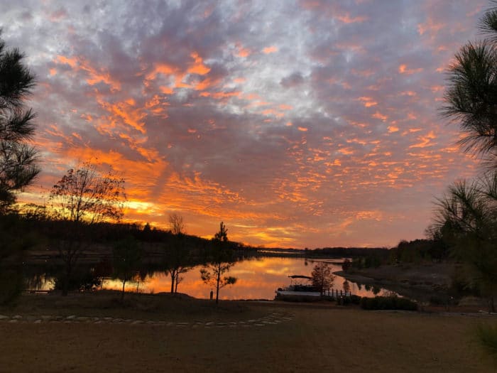 Beautiful, orange sunset on Cedar Creek Lake at the Long Cove Community