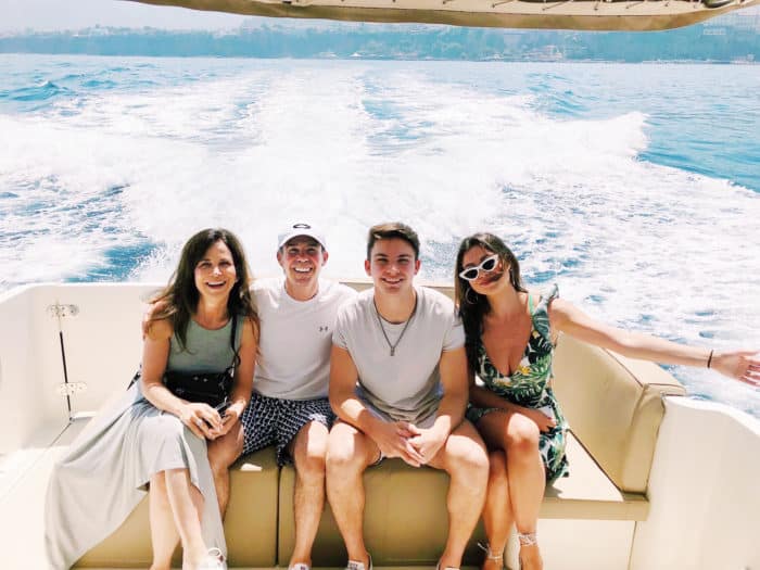 Family of four enjoying the day on a boat at Long Cove on Cedar Creek Lake