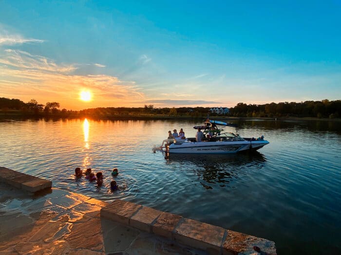 A sunset view of the Long Cove Boating and water play in the water of Cedar Creek Lake.